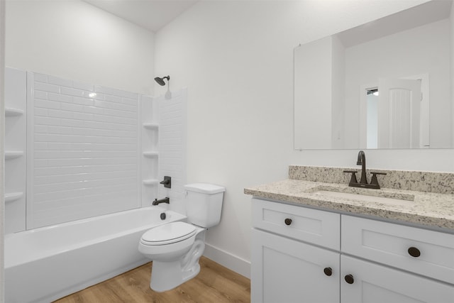 full bathroom with toilet,  shower combination, wood-type flooring, and vanity