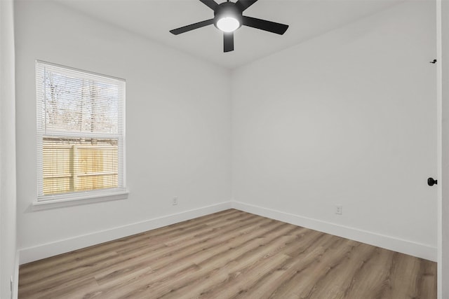 unfurnished room with light wood-type flooring and ceiling fan