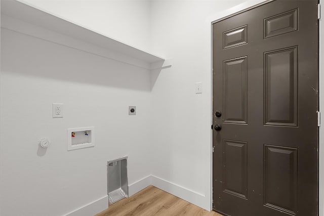 washroom featuring hookup for an electric dryer, hookup for a washing machine, and light hardwood / wood-style flooring