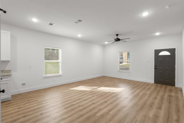 interior space with ceiling fan and light wood-type flooring