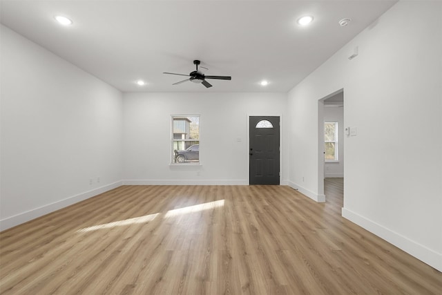 interior space with light wood-type flooring and ceiling fan