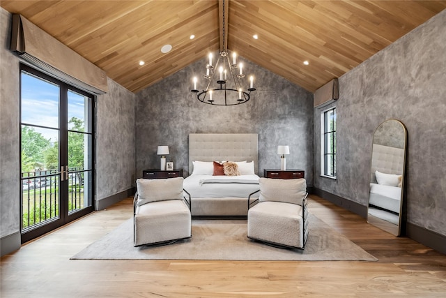 bedroom featuring high vaulted ceiling, access to exterior, a chandelier, and light hardwood / wood-style floors