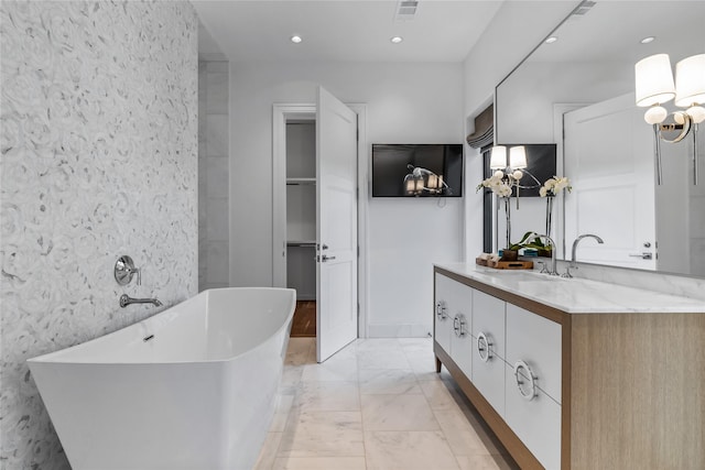 bathroom featuring a tub and vanity