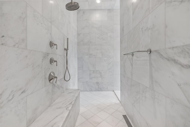 bathroom with a tile shower