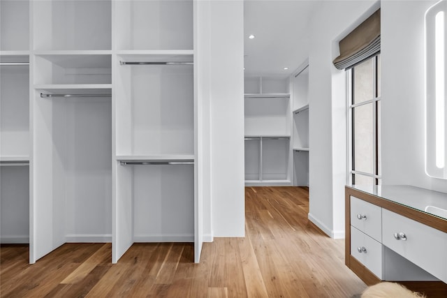 walk in closet featuring light wood-type flooring