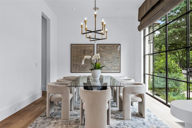 dining room featuring an inviting chandelier and light hardwood / wood-style floors