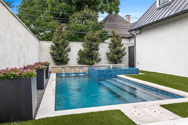 view of swimming pool with pool water feature and an in ground hot tub