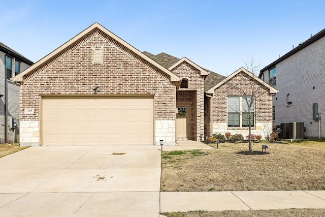 front of property with a garage and cooling unit