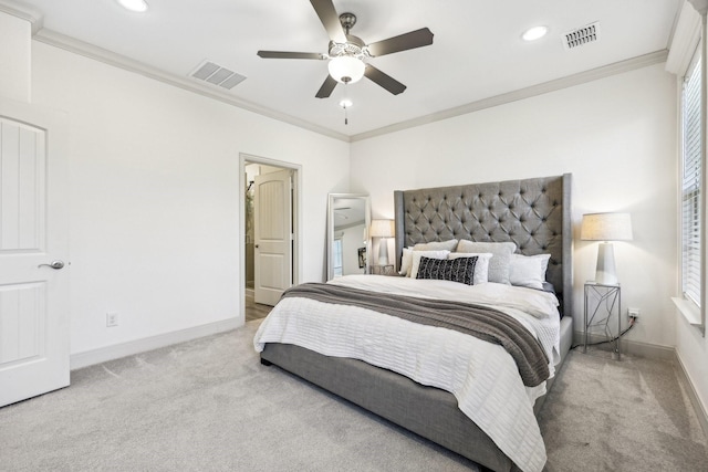 bedroom with light carpet, ceiling fan, and crown molding