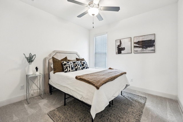 bedroom featuring light carpet and ceiling fan