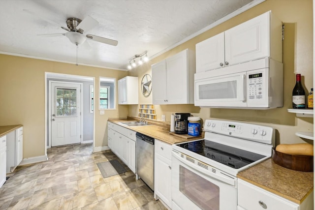 kitchen with ceiling fan, white cabinetry, sink, and white appliances