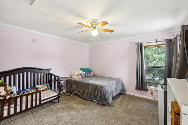 carpeted bedroom with ceiling fan and crown molding