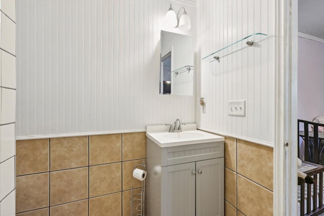 bathroom with vanity and ornamental molding