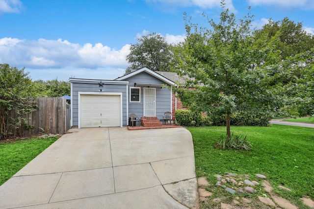 view of front facade with a front yard and a garage