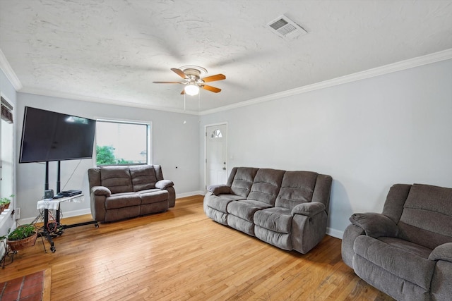 living room with ceiling fan, ornamental molding, and hardwood / wood-style flooring