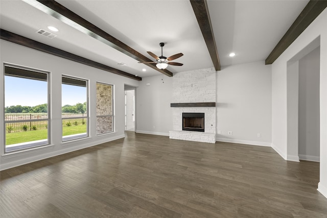 3270 Arbor Grove Trl, Midlothian, TX 76065 - unfurnished living room with a ceiling fan, beam ceiling, baseboards, a stone fireplace, and dark wood-type flooring
