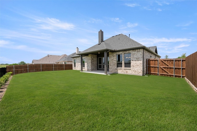 3270 Arbor Grove Trl, Midlothian, TX 76065 - rear view of house featuring a chimney, a patio, brick siding, and a shingled roof