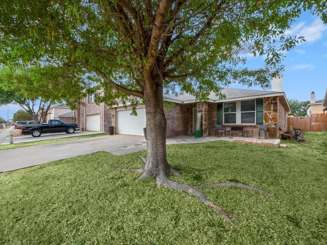 ranch-style house featuring a front lawn and a garage