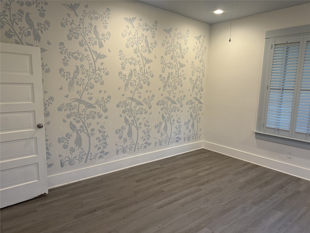 empty room with dark wood-type flooring