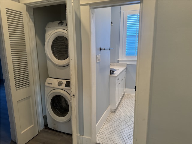 laundry area with stacked washer and dryer