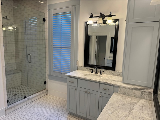 bathroom featuring vanity, tile patterned floors, and an enclosed shower