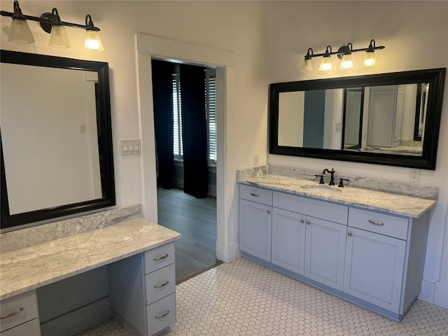 bathroom featuring tile patterned floors and vanity