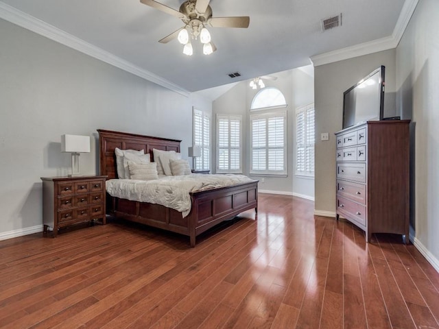 bedroom with crown molding, dark wood-type flooring, and ceiling fan