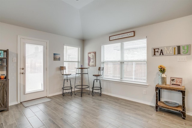 dining room with lofted ceiling