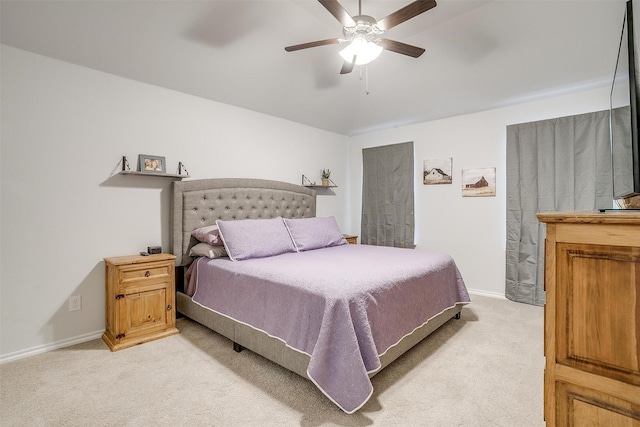 carpeted bedroom featuring ceiling fan and lofted ceiling