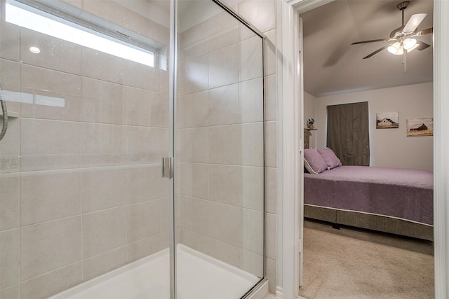 bathroom featuring ceiling fan, lofted ceiling, and a shower with shower door