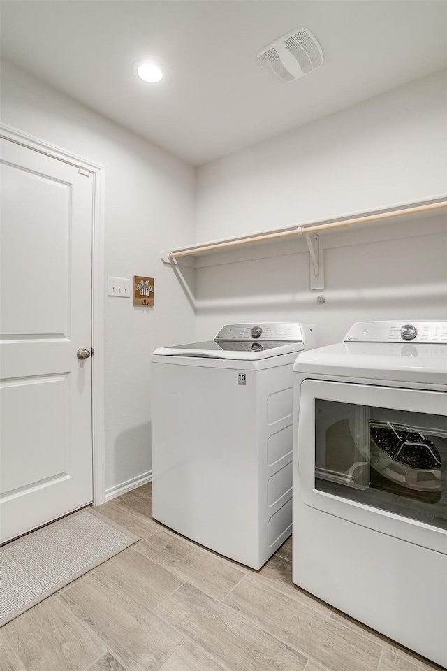 washroom featuring independent washer and dryer