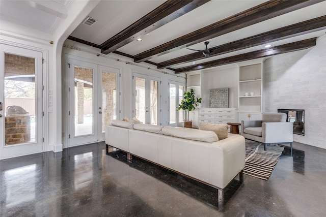 living room featuring beam ceiling, french doors, built in features, ceiling fan, and crown molding