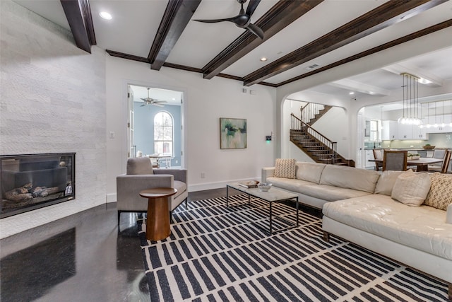 living room with beam ceiling and ceiling fan