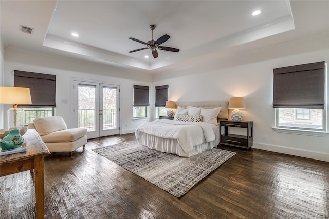 bedroom with ceiling fan, french doors, access to outside, and a tray ceiling