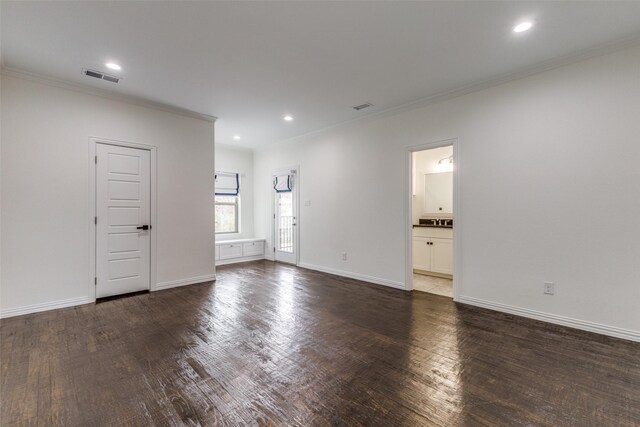 unfurnished room with dark wood-type flooring and crown molding