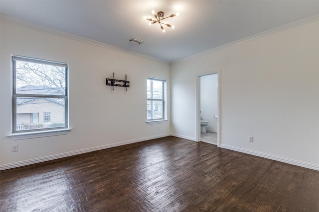 unfurnished room with plenty of natural light, dark hardwood / wood-style floors, and crown molding