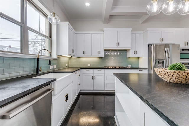 kitchen featuring white cabinets, pendant lighting, appliances with stainless steel finishes, and beam ceiling