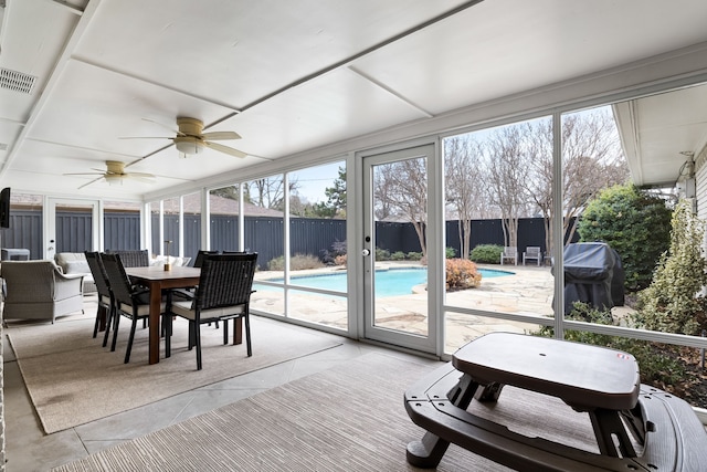 sunroom with ceiling fan and plenty of natural light