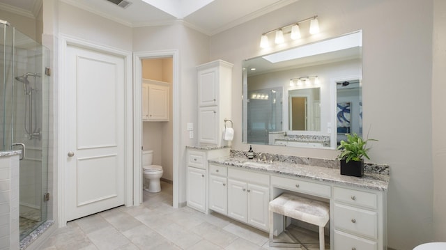 bathroom featuring tile patterned flooring, vanity, toilet, a shower with shower door, and crown molding