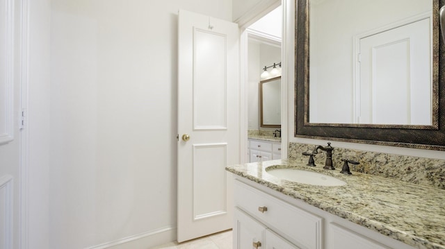 bathroom featuring tile patterned floors and vanity