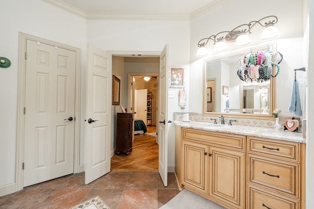 bathroom featuring vanity and crown molding