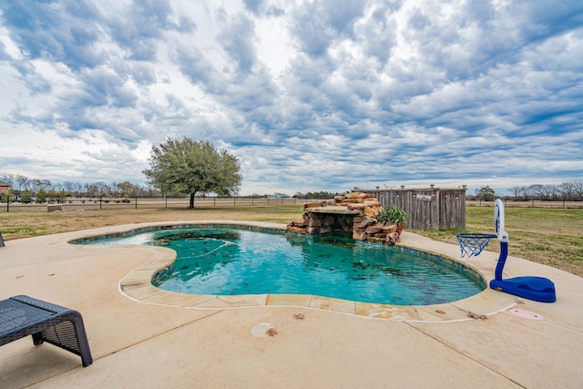 view of pool featuring pool water feature and a patio