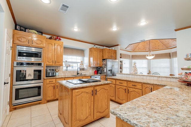 kitchen featuring a kitchen island, crown molding, and decorative light fixtures