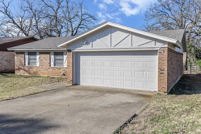 view of front of property with a front lawn and a garage