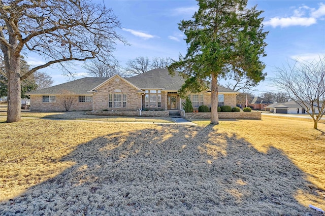 ranch-style house with a front lawn