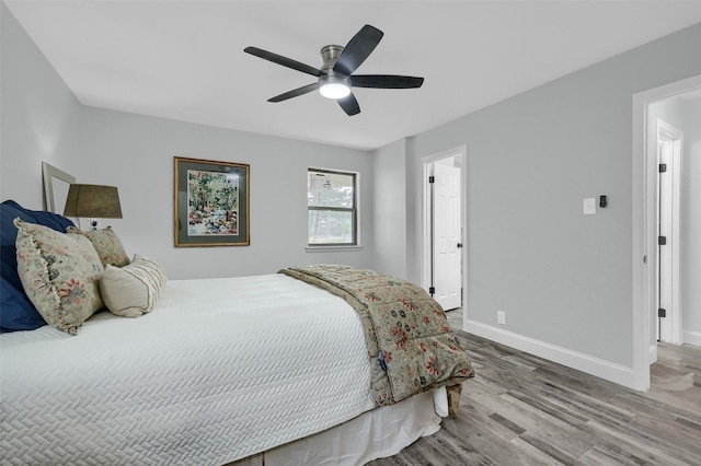 bedroom featuring ceiling fan and wood-type flooring