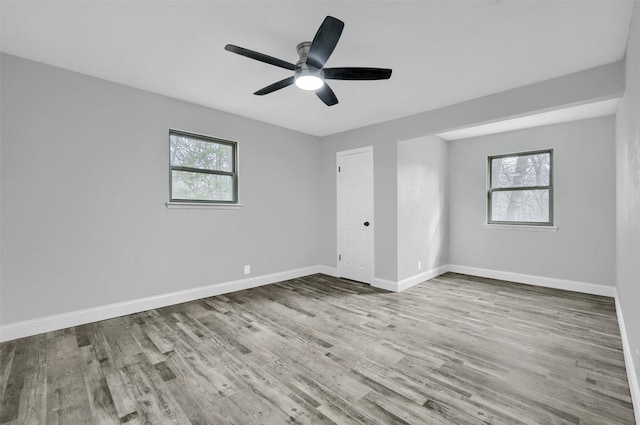 spare room featuring light hardwood / wood-style floors and ceiling fan