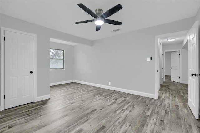 unfurnished room featuring ceiling fan and light wood-type flooring