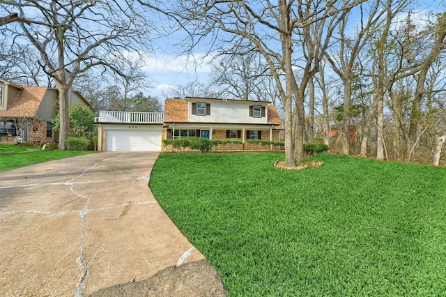 view of front of house with a garage and a front lawn