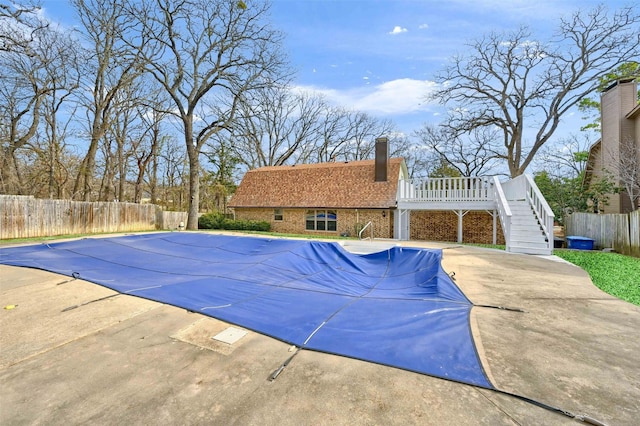 view of pool with a deck and a patio area